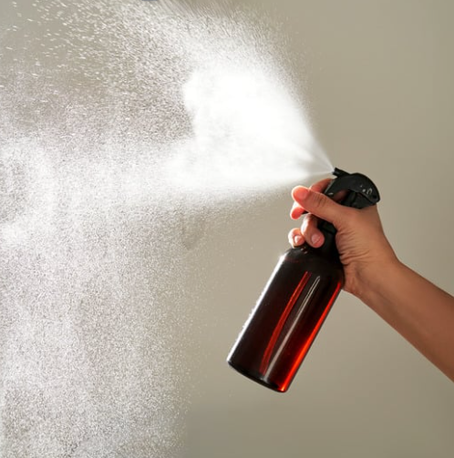Room Spray bottle being used 