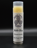 Lip/body balm stick labeled 'Ahh-Ha' with 'Sacred Circle Boutique' logo on a black background