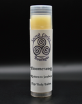 Lip/body balm stick labeled 'Boomerang' with 'Sacred Circle Boutique' logo on a black background